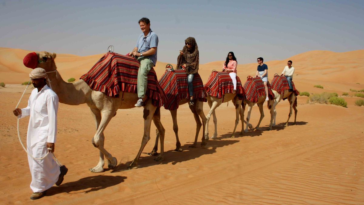 Camel riding in the desert